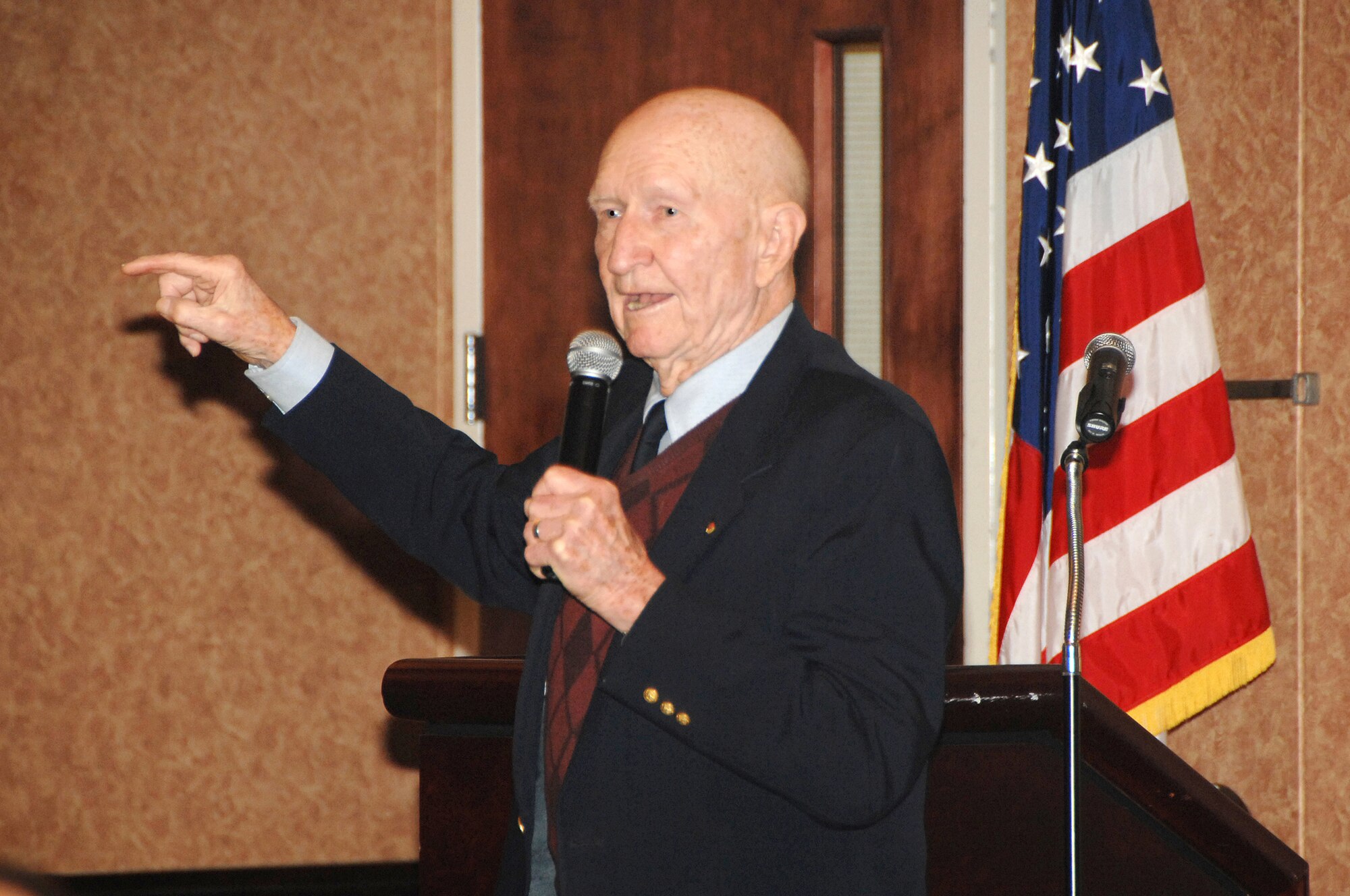 Retired Col. Gail Halvorsen speaks to a group of Airmen during the Airlift Tanker Association Luncheon at Travis Dec. 10, 2009. Colonel Halverson is known as the “Candy Bomber” for dropping candy from his aircraft to German children during the 1948 Berlin Airlift. (U.S. Air Force photo/Amanda Lopez)