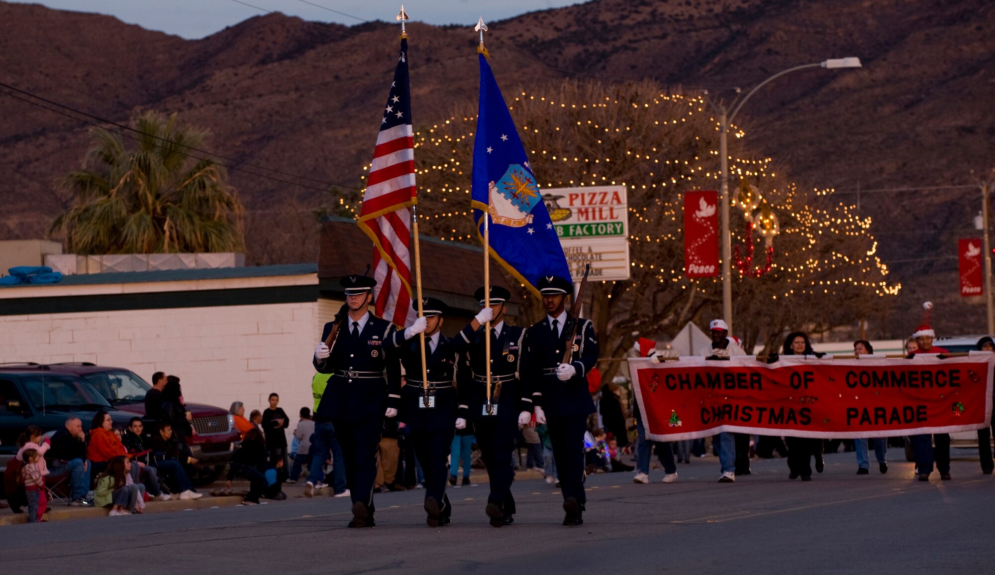 ALAMOGORDO, N.M. -- Members of the Steel Talon Honor Guard from Holloman Air Force Base lead the way during the Chamber of Commerce Christmas parade here Dec. 12. Many members of Team Holloman participated in the yearly holiday event. (U.S. Air Force photo by Tech. Sgt. Alan Port)