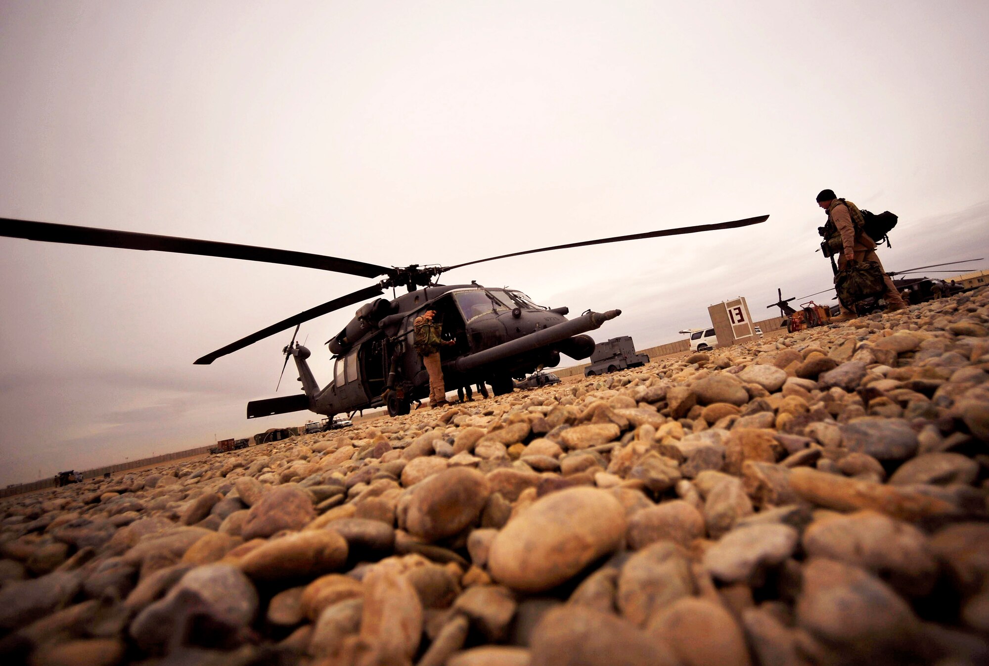 U.S. Air Force Airmen from the 66th Expeditionary Rescue Squadron deployed to Camp Bastion, Afghanistan, load their HH-60 Pave Hawk with gear, Dec. 8, 2009. This ensures the team can respond in a moment's notice to rescue a patient and have everything needed to treat them. (U.S. Air Force photo/Staff Sgt. Angelita Lawrence)