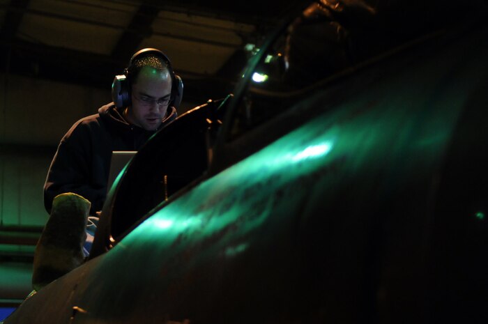Mr. Ron Deagle with the 9th Maintenance Squadron runs diagnostics tests after installing the Optical Bar Camera (OBC) into the fusel lodge of a U-2 Dragon Lady, Dec. 11.  The OBC undergoes a multitude of operational tests prior to being certified for deployment.  (U.S. Air Force photo / Staff Sgt Aaron C. Oelrich)   