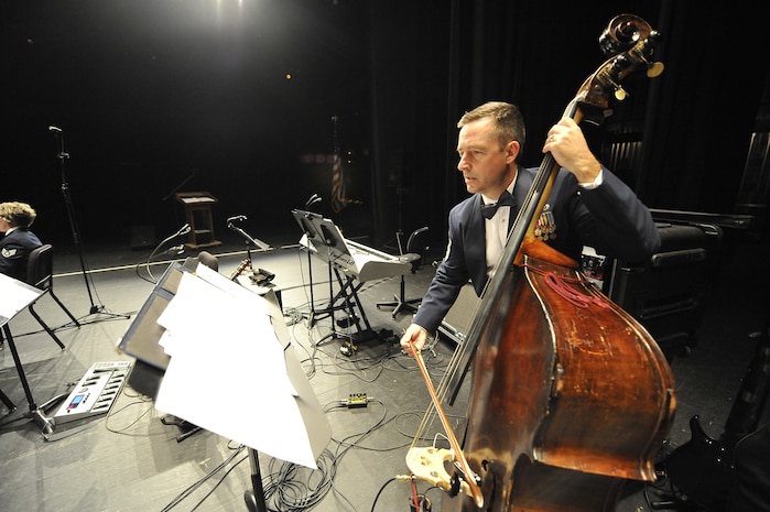 U.S. Air Force Master Sgt. J.R. Erb plays the bass during the United States Air Force Heritage of America Band show at the North Charleston Performing Arts Center in North Charleston, S.C., Dec. 9, 2009. The Heritage of America Band has performed ceremonies for U.S. presidents and foreign heads of state, including the queen of England and the president of France. Sergeant Erb is the non-commissioned officer in charge of the concert band. (U.S. Air Force photo by James M. Bowman)(Released)