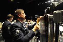U.S. Air Force Staff Sgt. Reid Stockdill plays the chimes during the United States Air Force Heritage of America Band show at the North Charleston Performing Arts Center in North Charleston, S.C., Dec. 9, 2009. The Heritage of America Band has performed ceremonies for U.S. presidents and foreign heads of state, including the queen of England and the president of France. Sergeant Stockdill is a bandsman with the Air Force Heritage of America Band. (U.S. Air Force photo by James M. Bowman)(Released)