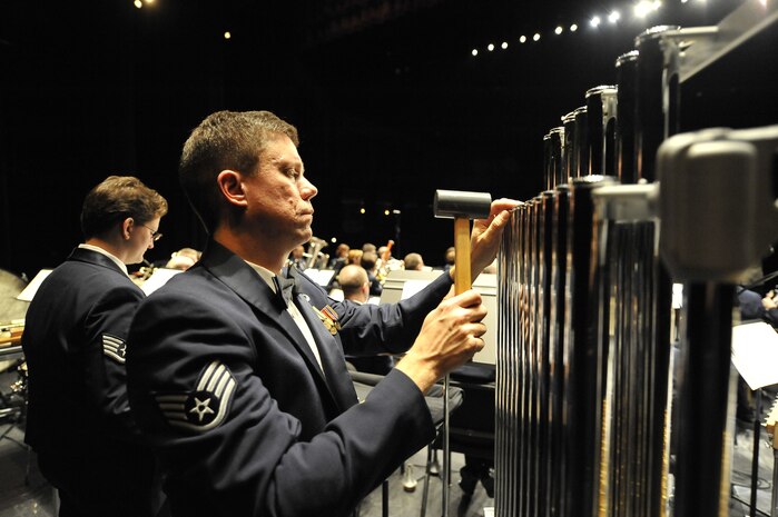 U.S. Air Force Staff Sgt. Reid Stockdill plays the chimes during the United States Air Force Heritage of America Band show at the North Charleston Performing Arts Center in North Charleston, S.C., Dec. 9, 2009. The Heritage of America Band has performed ceremonies for U.S. presidents and foreign heads of state, including the queen of England and the president of France. Sergeant Stockdill is a bandsman with the Air Force Heritage of America Band. (U.S. Air Force photo by James M. Bowman)(Released)