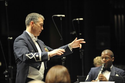 U.S. Air Force Lt. Col. Douglas Monroe conducts the United States Air Force Heritage of America Band at the North Charleston Performing Arts Center in North Charleston, S.C., Dec. 9, 2009. For more than half a century, the band has represented the Air Force with musical and military distinction. Colonel Monroe is the commander and conductor for the Heritage band. (U.S. Air Force photo by James M. Bowman)(Released)