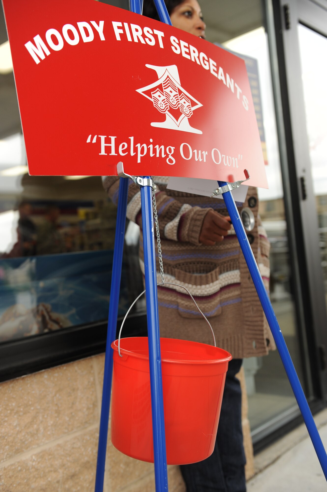 MOODY AIR FORCE BASE, Ga. -- Master Sgt. Janice Preston, 23rd Force Support Squadron career development superintendent, volunteers to ring the bell for donations during the Ring-a-Bell program here Dec. 11. The Moody First Sergeant’s Association is hosting the event and the money raised will be given to needy families at Moody. (U.S. Air Force photo by Airman 1st Class Benjamin Wiseman)
