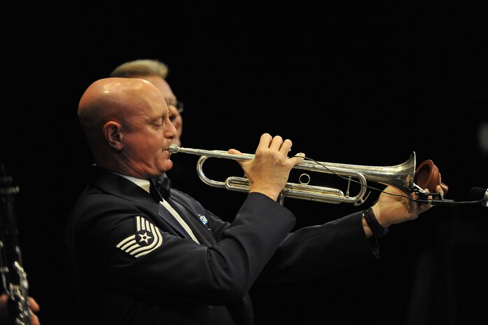U.S. Air Force Tech. Sgt. Kerry Moffit plays a trumpet during the United States Air Force Heritage of America Band show at the North Charleston Performing Arts Center in North Charleston, S.C., Dec. 9, 2009. The United States Air Force Heritage of America Band has a rich history of inspiring hearts and minds, building and sustaining American patriotism and enhancing esprit de corps in the United States Air Force. Sergeant Moffit is a bandsman with the U.S. Air Force Heritage of America Band. (U.S. Air Force photo by James M. Bowman)(Released)