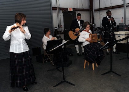 Members of the USAF Heritage of America Band's Heritage Aire visited Charleston AFB and played Christmas carols at 11 different locations across the base Dec. 10. The goal of caroling around the base was to give Airmen a brief break from work to bring them some holiday cheer.(U.S. Air Force photo/Senior Airman Katie Gieratz)(RELEASED)

