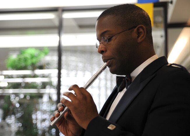 Tech. Sgt. Joshua Gates plays the Irish Penny Whistle during a visit here Dec. 10. Sergeant Gates is with Heritage Aire, a component of the USAF Heritage of American Band that incorporates Celtic music into their performances. Sergeant Gates is a member of the USAF Heritage of America Band. (U.S. Air Force photo/Senior Airman Katie Gieratz)(RELEASED)

