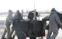 MINOT AIR FORCE BASE, N.D. -- Airmen from the 5th Aircraft Maintenance Squadron inspect a B-52H Stratofortress during Prairie Vigilance 12-2 here Dec. 10. Prairie Vigilance is a combined-wing nuclear operational readiness exercise designed to demonstrate safe, secure, reliable nuclear weapons standards and procedures. (U.S. Air Force photo by Airman 1st Class Jesse Lopez)