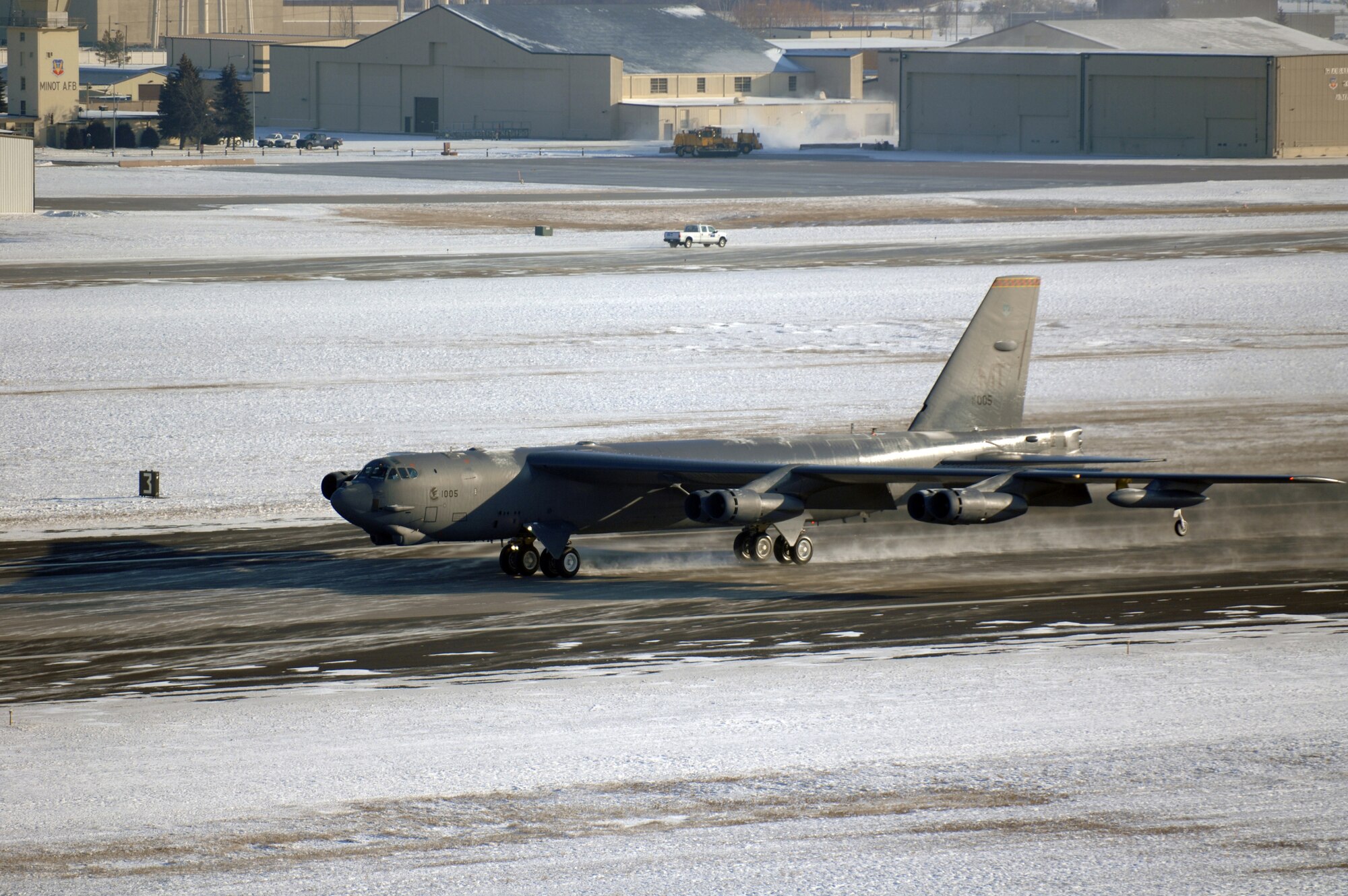 MINOT AIR FORCE BASE, N.D. -- A B-52H Stratofortress flies through the harsh weather during the rapid launch portion of Prairie Vigilance here Dec. 10. Prairie Vigilance 10-9 is a combined nuclear operational readiness exercise designed to demonstrate safe, secure, reliable nuclear weapons standards and procedures. (U.S. Air Force photo by Airman 1st Class Aaron-Forrest Wainwright)