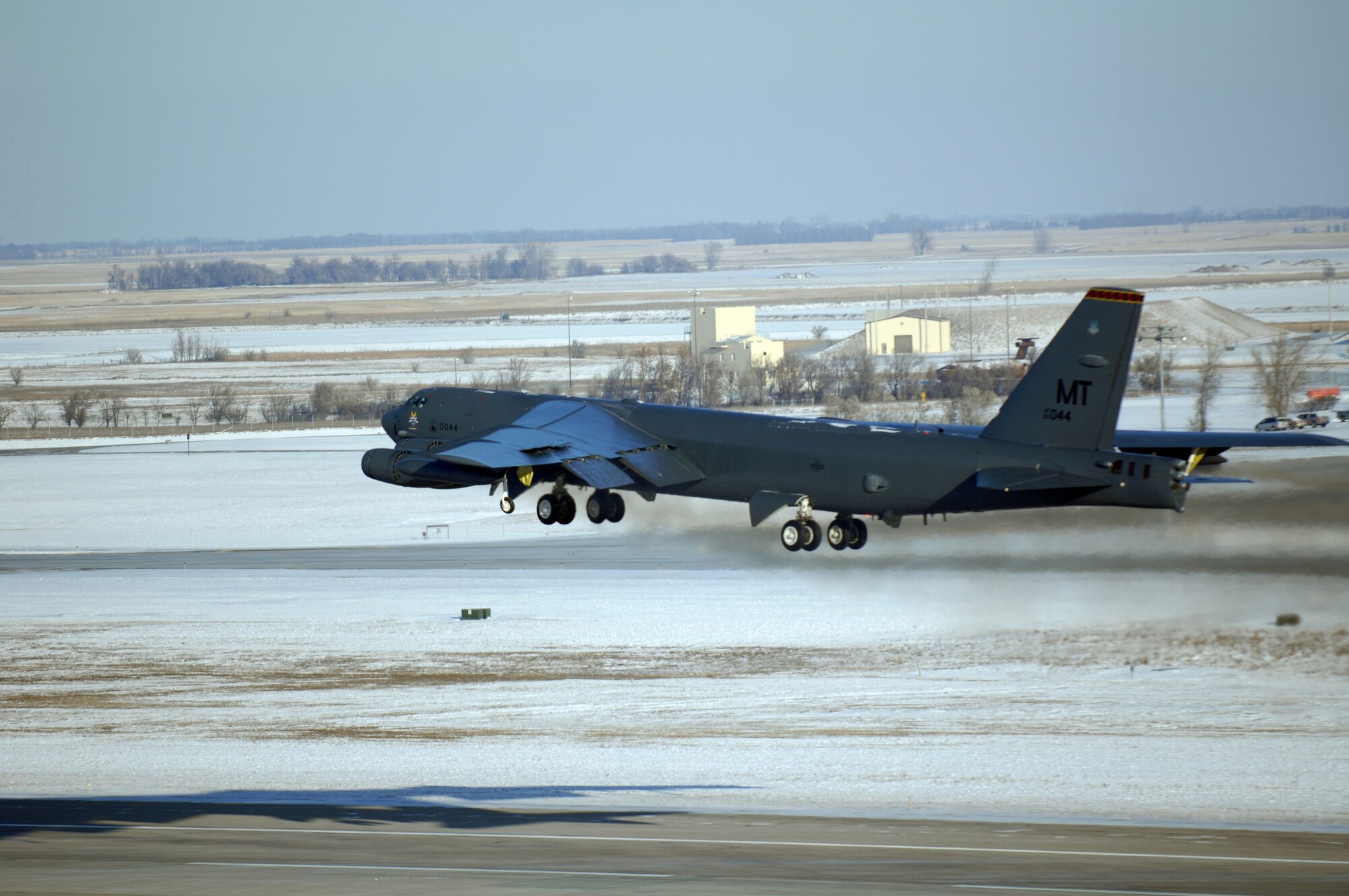 MINOT AIR FORCE BASE, N.D. -- A B-52H Stratofortress flies through the harsh weather during the rapid launch portion of Prairie Vigilance here Dec. 10. Prairie Vigilance 10-9 is a combined nuclear operational readiness exercise designed to demonstrate safe, secure, reliable nuclear weapons standards and procedures. (U.S. Air Force photo by Airman 1st Class Aaron-Forrest Wainwright)