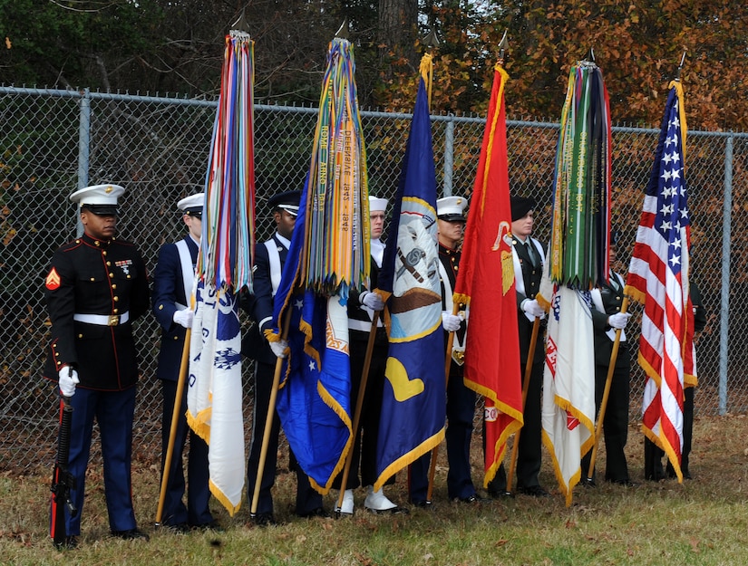SUFFOLK, Va. -- A joint forces honor guard stands at parade rest during the Wreaths Across America ceremony Dec. 12.  Military personnel and the local community laid 2,250 wreaths on the headstones of fallen veterans.  (U.S. Air Force photo/Senior Airman Zachary Wolf)

