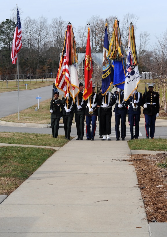 SUFFOLK, Va. -- A joint forces honor guard marches to present the colors, during the Wreaths Across America ceremony Dec. 12.  Military personnel and the local community laid 2,250 wreaths on the headstones of fallen veterans.  (U.S. Air Force photo/Senior Airman Zachary Wolf)
