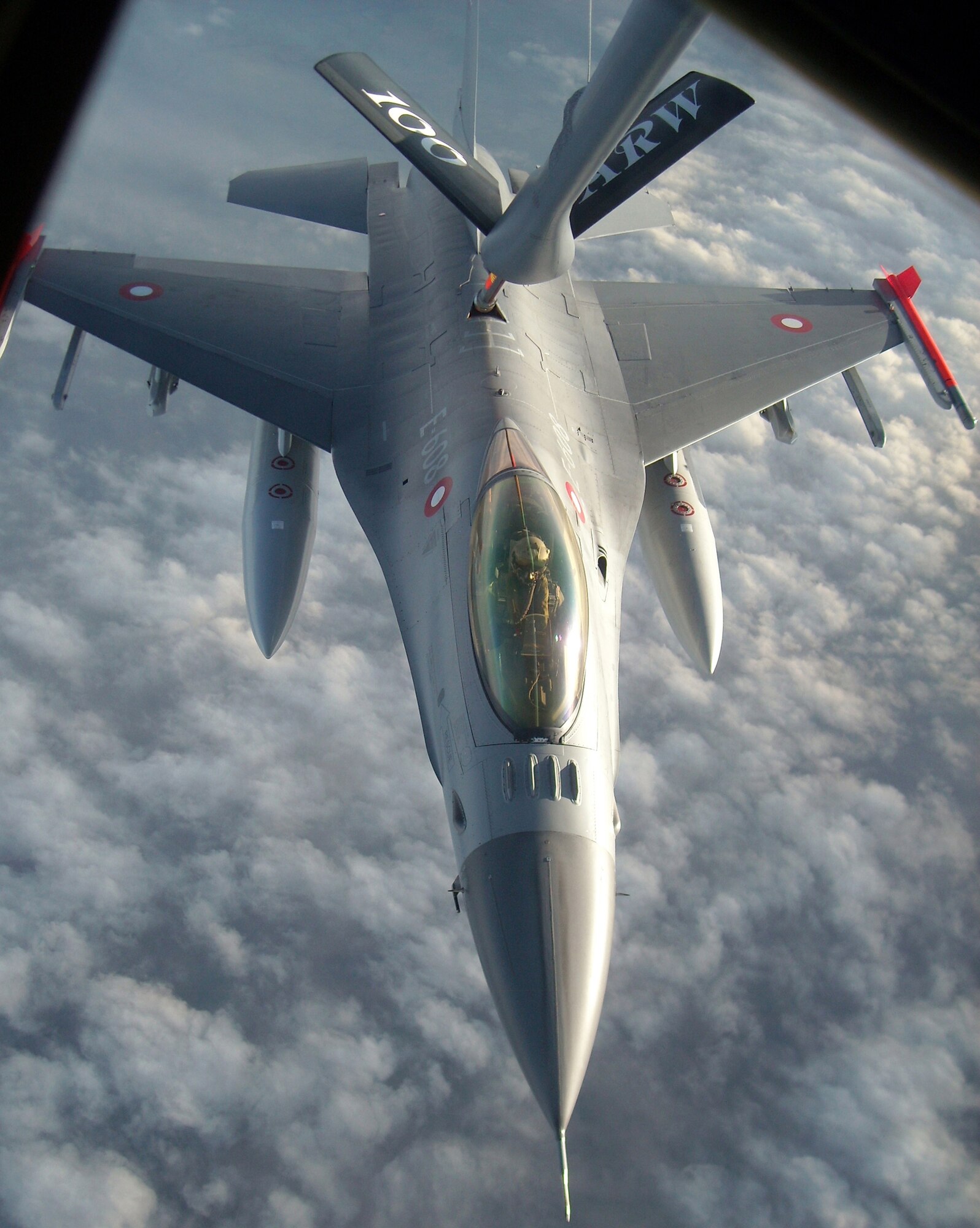 A Royal Danish air force F-16 Fighting Falcon receives fuel Dec. 8, 2009 as Chief Master Sgt. Christopher Powell commands the operation. The Danish F-16 was one of 30 performing their semi-annual aerial refueling training. Chief Powell is a 100th Operations Group boom operator. (U.S. Air Force photo/Tech. Sgt. Kevin Wallace)