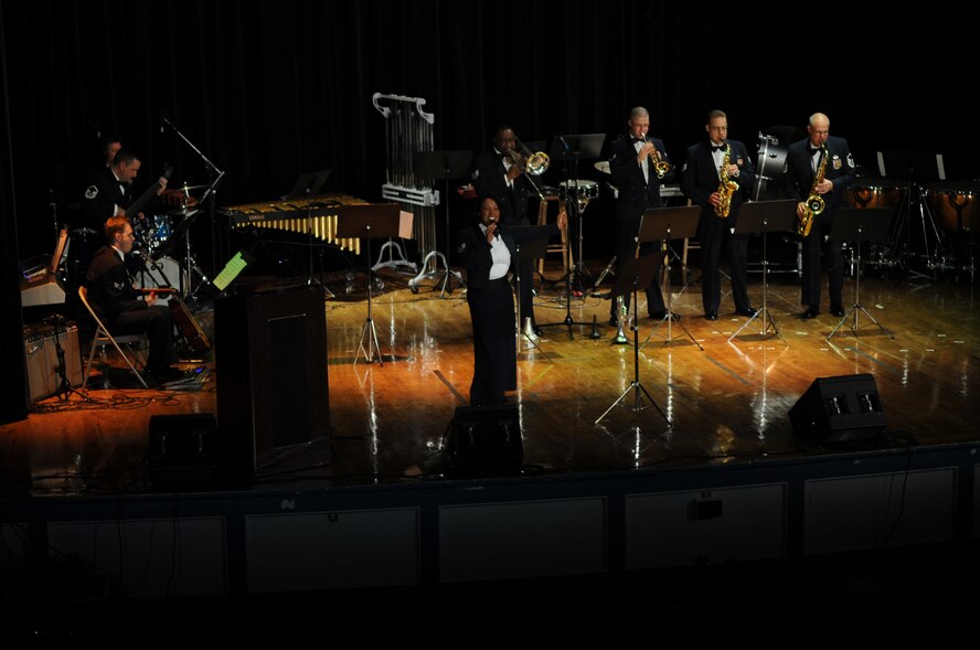 Staff Sgt. Natalie Madison, United States Air Force Heritage of America Band vocalist, performs during a holiday concert at Goldsboro High School, N.C., Dec. 7, 2009. The band hosted a free concert for the Airmen of Seymour Johnson Air Force Base, N.C., and the local community. Sergeant Madison is originally from Islip, N.Y. (U.S. Air Force photo/Staff Sgt. Courtney Richardson) 