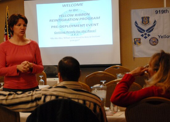 Senior Master Sgt. Patricia Click, 919th Special Operations Wing staff, answers questions regarding health care coverage during a local Yellow Ribbon event Dec. 12 held in Fort Walton Beach, Fla.  The Yellow Ribbon program provides reservists and their families the opportunity to learn and prepare for specific issues people face during a deployment cycle.  (U.S. Air Force photo/ Staff Sgt. Samuel King Jr.)