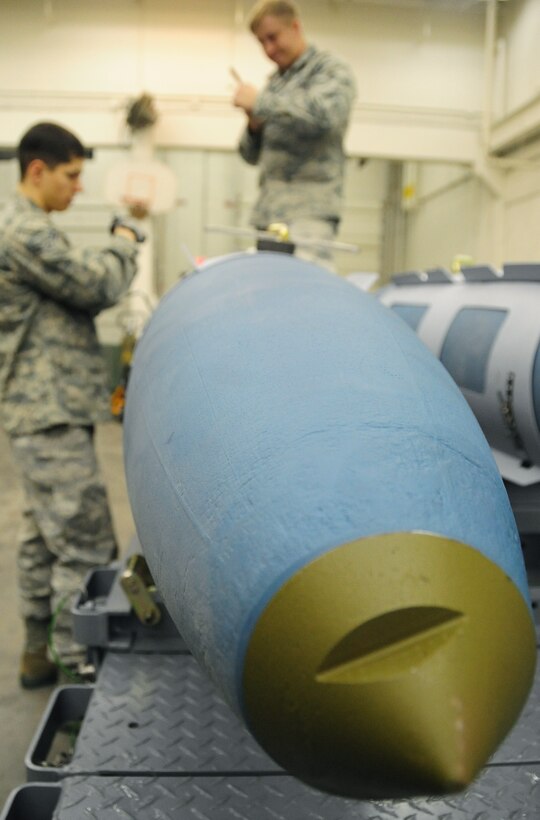 ELLSWORTH AIR FORCE BASE, S.D. -- (Left to right) Airman 1st Class Aaron Valdez and Senior Airman Myco Wilson, 28th Munitions Squadron conventional maintenance crew members, take apart their tools after securing an aerosurface assembly on an inert Guided Bomb Unit-31, Dec. 8.  The aerosurface assembly is designed to stabilize the GBU-31. (U.S. Air Force photo/Airman 1st Class Anthony Sanchelli)





