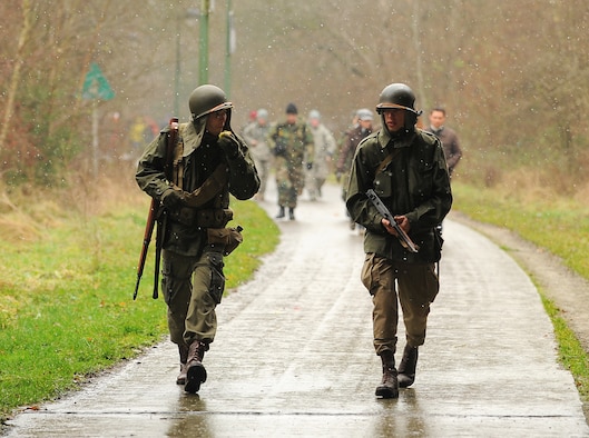 BASTOGNE, Belgium -- World War II reenactors walk along a trail Dec. 12 during the 32nd Bastogne Historic Walk here in Bastogne. Despite the snow and cold, more than 4,500 people from across Europe and the world participated in the event. (U.S. Air Force photo/Airman 1st Class Nathanael Callon)