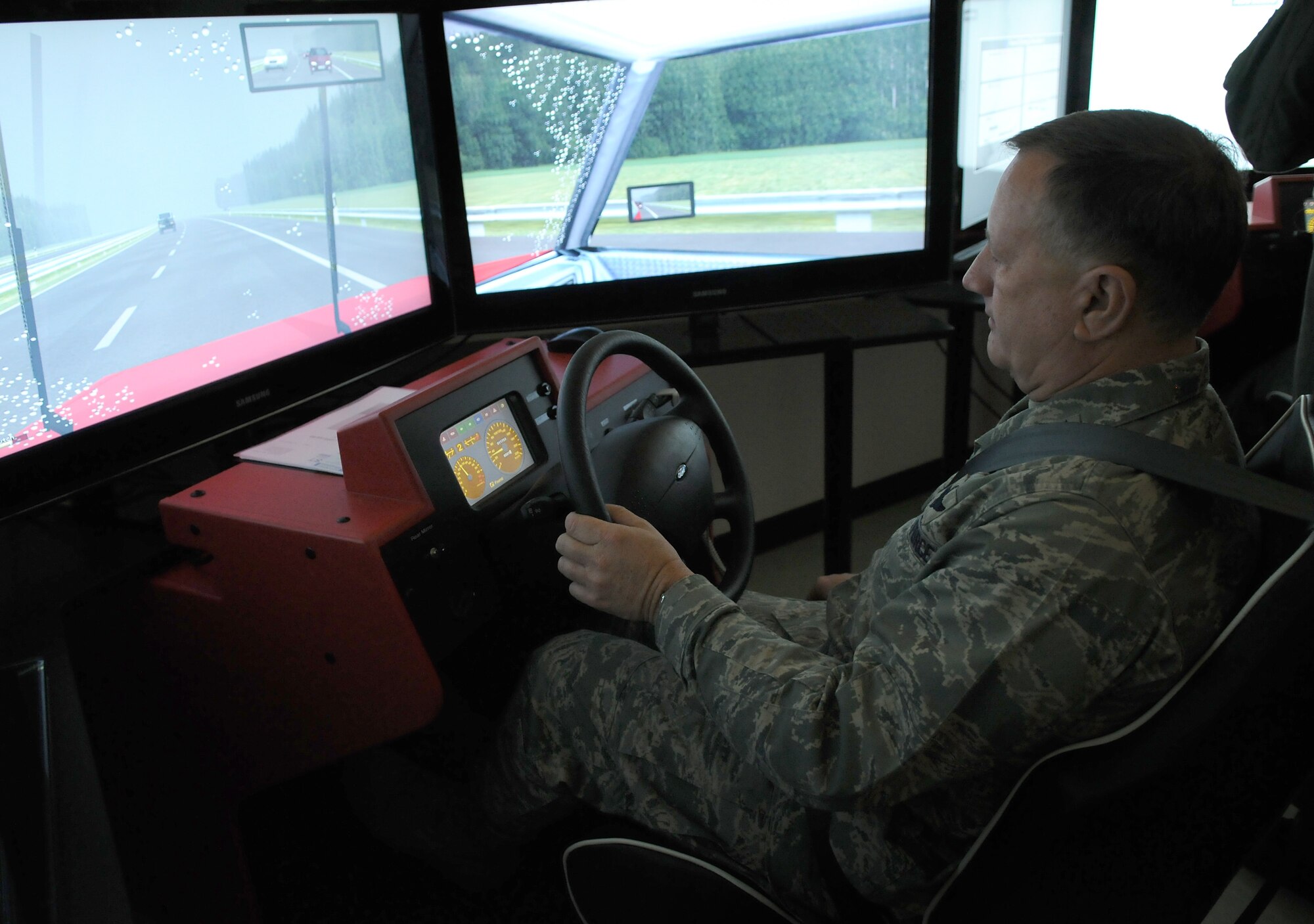 SPANGDAHLEM AIR BASE, Germany -- Maj. Gen. Frederick Roggero, Air Force chief of safety, tests a new driving simulator in the 52nd Fighter Wing Safety Office Dec. 11 here. The driving simulator can simulate different driving conditions and hazards, as well as the effects of driving under the influence of alcohol. (U.S. Air Force photo/Airman 1st Class Nathanael Callon)