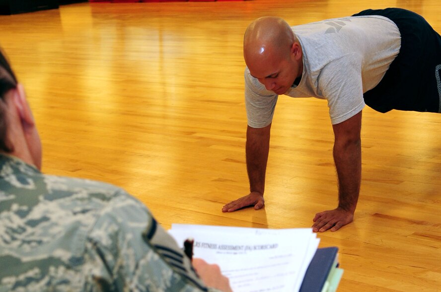 BARKSDALE AIR FORCE BASE, La. -- A physical training leader is inspected on her ability to test and evaluate her squadron members during a conventional operational readiness inspection, Dec. 12. Squadron PTLs were chosen at random to perform the new Air Force standard for physical training tests that will go into effect in January to ensure Barksdale understanding and compliance of the new program. (U.S. Air Force photo by Senior Airman Joanna M. Kresge)