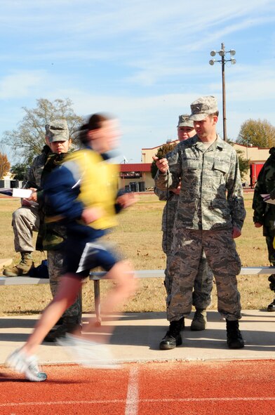 BARKSDALE AIR FORCE BASE, La. -- A physical training leader is inspected on his ability to test and evaluate his squadron members during a conventional operational readiness inspection, Dec. 12. Squadron PTLs were chosen at random to perform the new Air Force standard for physical training tests that will go into effect in January to ensure Barksdale understanding and compliance of the new program. (U.S. Air Force photo by Senior Airman Joanna M. Kresge)