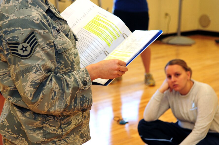 BARKSDALE AIR FORCE BASE, La. -- Staff Sgt. Saray Moniz, physical training leader from the 2d Medical Operations Squadron is inspected on her ability to test and evaluate her squadron members during a conventional operational readiness inspection, Dec. 12. Squadron PTLs were chosen at random to perform the new Air Force standard for physical training tests that will go into effect in January to ensure Barksdale understanding and compliance of the new program. (U.S. Air Force photo by Senior Airman Joanna M. Kresge)