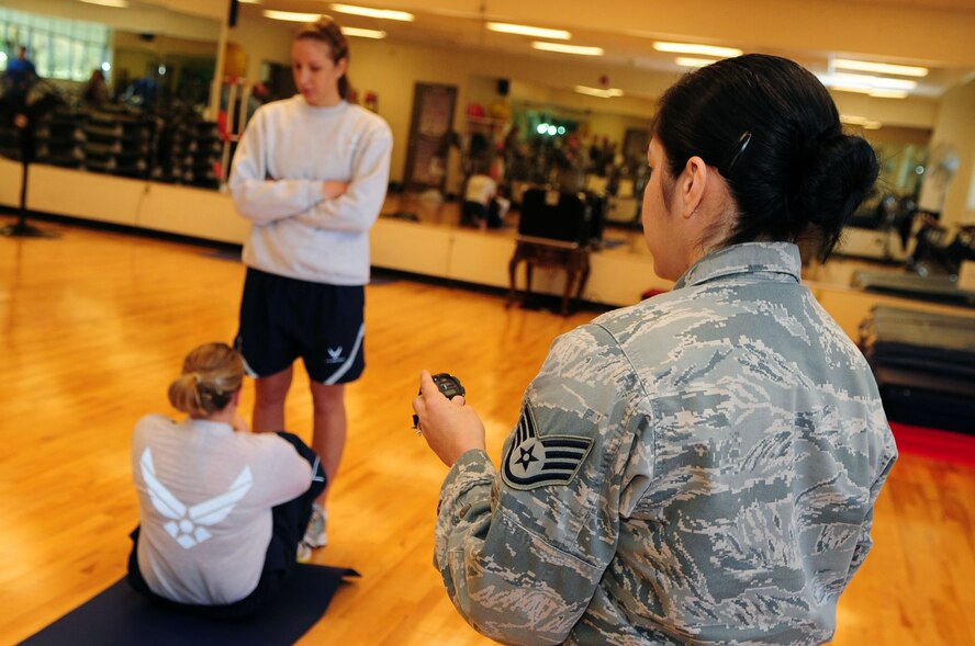 BARKSDALE AIR FORCE BASE, La. -- Staff Sgt. Saray Moniz, physical training leader from the 2d Medical Operations Squadron is inspected on her ability to test and evaluate her squadron members during a conventional operational readiness inspection, Dec. 12. Squadron PTLs were chosen at random to perform the new Air Force standard for physical training tests that will go into effect in January to ensure Barksdale understanding and compliance of the new program. (U.S. Air Force photo by Senior Airman Joanna M. Kresge)