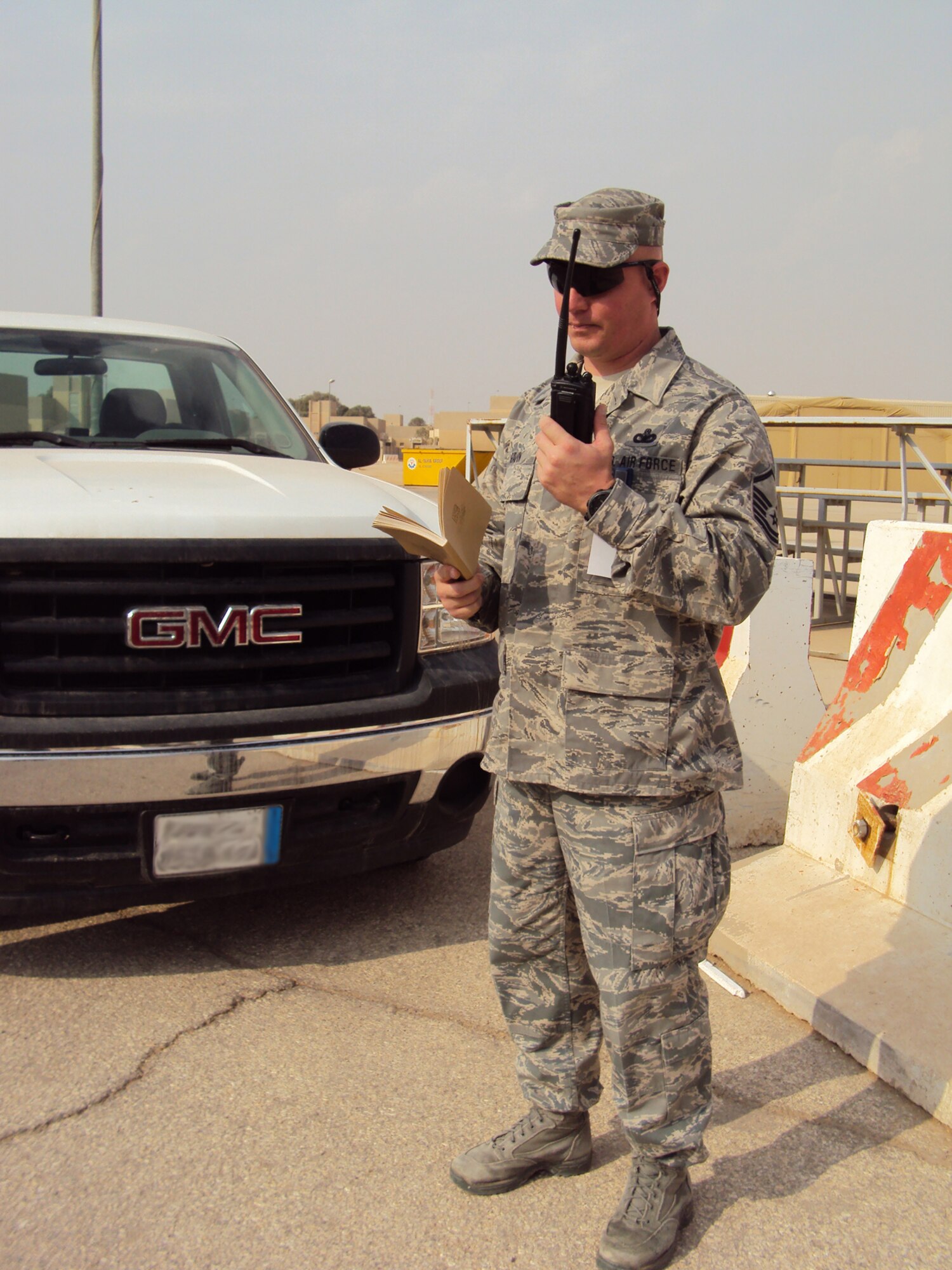 SOUTHWEST ASIA—Master Sgt. Korie Gavan, 64th Air Expeditionary Group, controls a scenario as part of the base exercise evaluation team at an undisclosed location, recently. The exercise tested unit readiness and the ability to operate during an attack. Sergeant Gavan is deployed from the District of Colombia Air National Guard’s 113th Security Forces Squadron in support of operations Iraqi Freedom and Enduring Freedom. (U.S. Air Force photo/Staff Sgt. Kyle Ray)