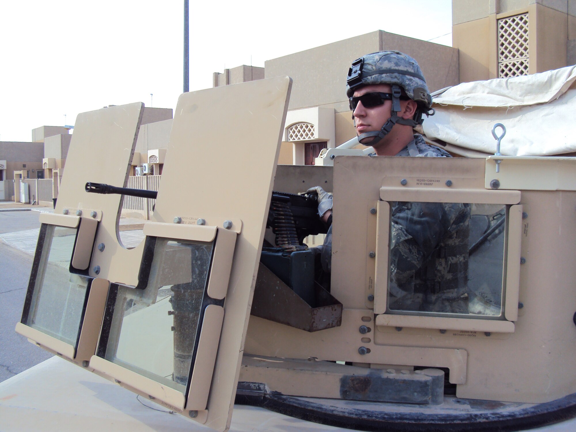 SOUTHWEST ASIA ? Senior Airman Matthew Munday, 64th Expeditionary Security Forces Squadron M-249 squad automatic weapon gunner, responds to a scenario during a recent base-wide exercise at an undisclosed location. The exercise tested both unit readiness and the base?s ability to operate while under attack. Airmen Munday is deployed from the Texas Air National Guard in support of operations Iraqi Freedom and Enduring Freedom. (U.S. Air Force Photo/Staff Sgt. Kyle Ray)