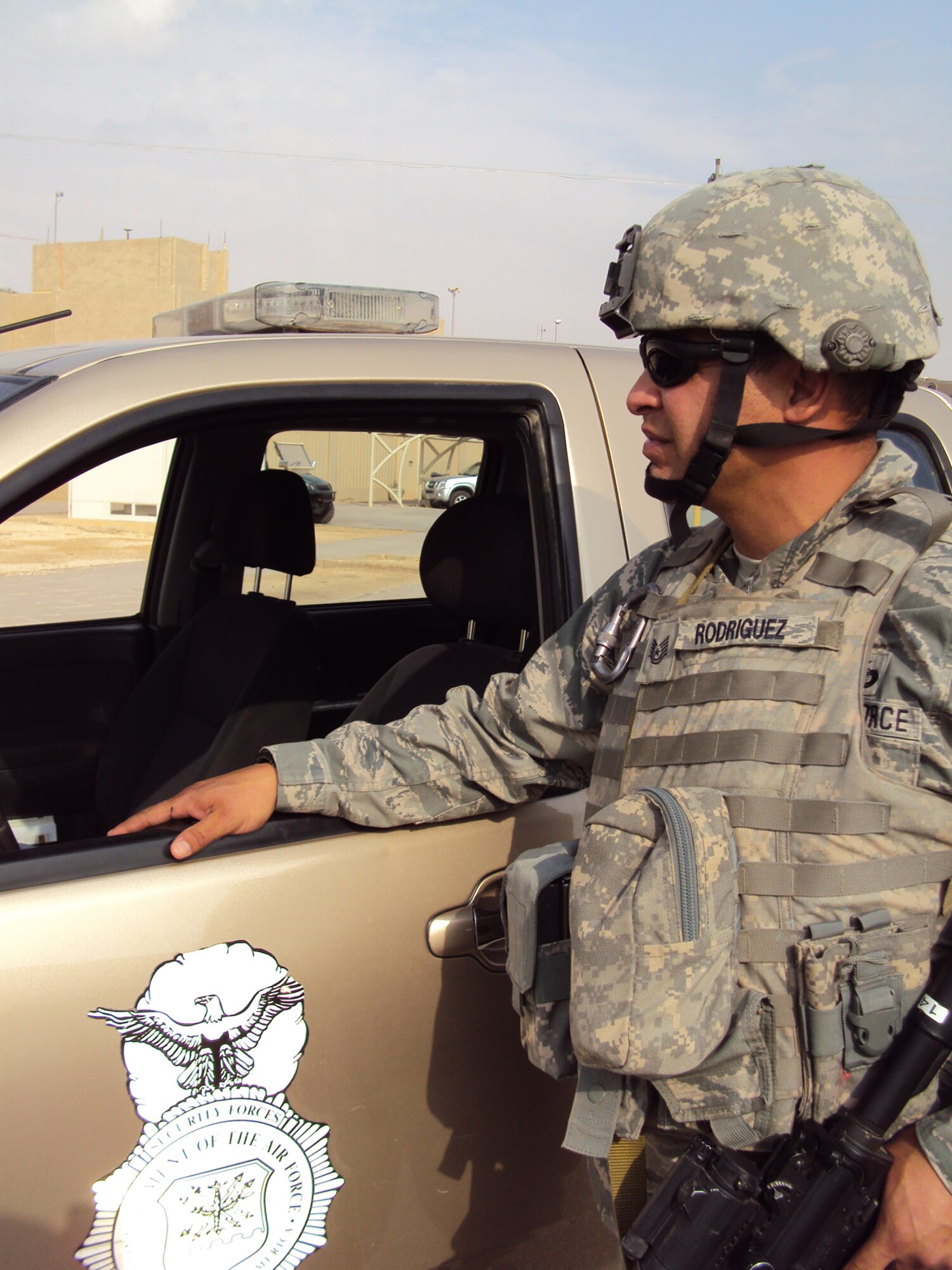 SOUTHWEST ASIA--Tech. Sgt. Julio Rodriguez, 64th Expeditionary Security Forces Squadron, responds to a scenario during a recent base exercise. Members of the 64 ESFS regularly conduct base-wide exercises to ensure readiness and test base first responders. Sergeant Rodriguez is deployed from the California National Guard?s 146th Security Forces Squadron in support of operations Iraqi Freedom and Enduring Freedom. (U.S. Air Force photo/Staff Sgt. Kyle Ray) 