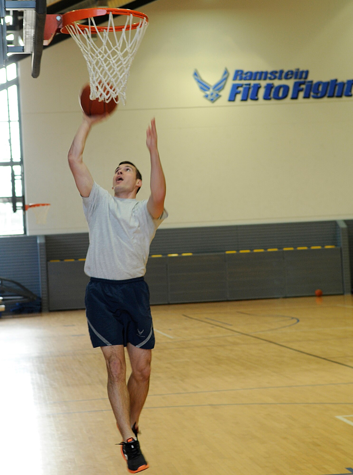 U.S. Air Force Senior Airman Adam Gradyan, 7th Weather Squadron, performs a layup, Dec. 7, 2009, Ramstein Air Base, Germany. Airman Gradyan was one of 12 Airmen to achieve a perfect 100 on his physical assessment test for the month of November. (U.S. Air Force photo by Airman Desiree Esposito)