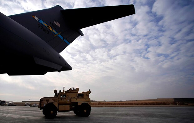 U.S. Air Force Master Sgt. Steve Thomas, 451st Expeditionary Logistics Readiness Squadron Det. 1 area port superintendent, stationed at Pope AFB, N.C., deployed to Camp Bastion, Afghanistan, off loads an MRAP from a C-17 Globemaster III, Dec. 11, 2009. New MRAPs will provide safety and security to ground troops during convoy operations. (U.S. Air Force photo/Staff Sgt. Angelita Lawrence)
