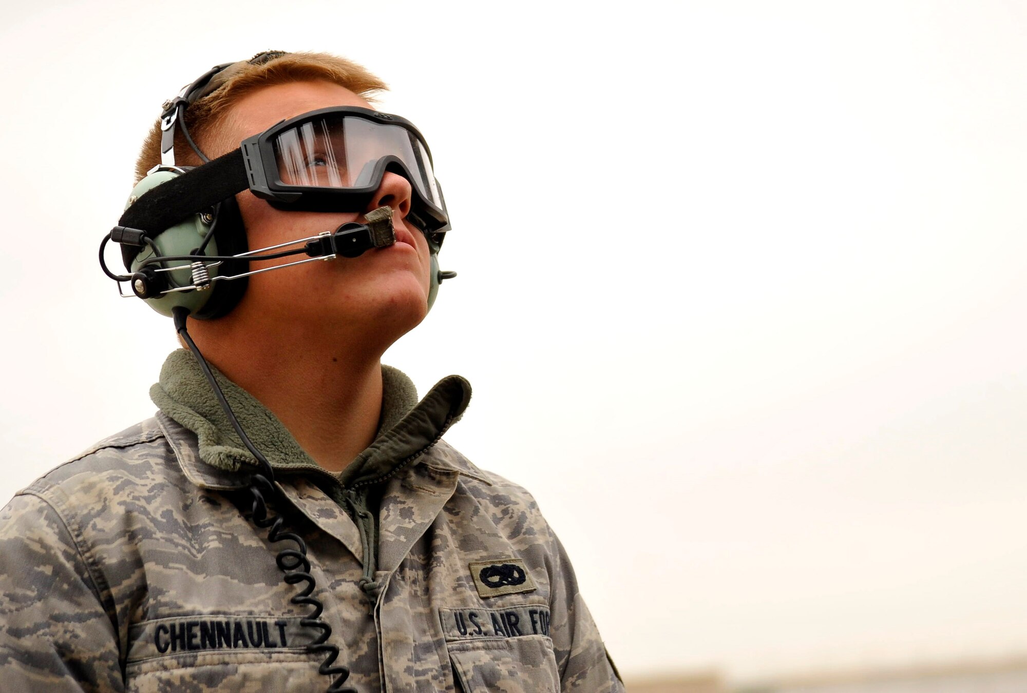 U.S. Air Force Airman 1st Class William Chennault, 451st Air Expeditionary Squadron crew chief, stationed at Moody AFB, Ga., deployed to Camp Bastion, Afghanistan, looks at the main rotor blades of an HH-60 Pave Hawk, Dec. 8, 2009. This inspection ensures the Pave Hawk did not receive any damage while picking up a patient.  (U.S. Air Force photo/Staff Sgt. Angelita Lawrence)
