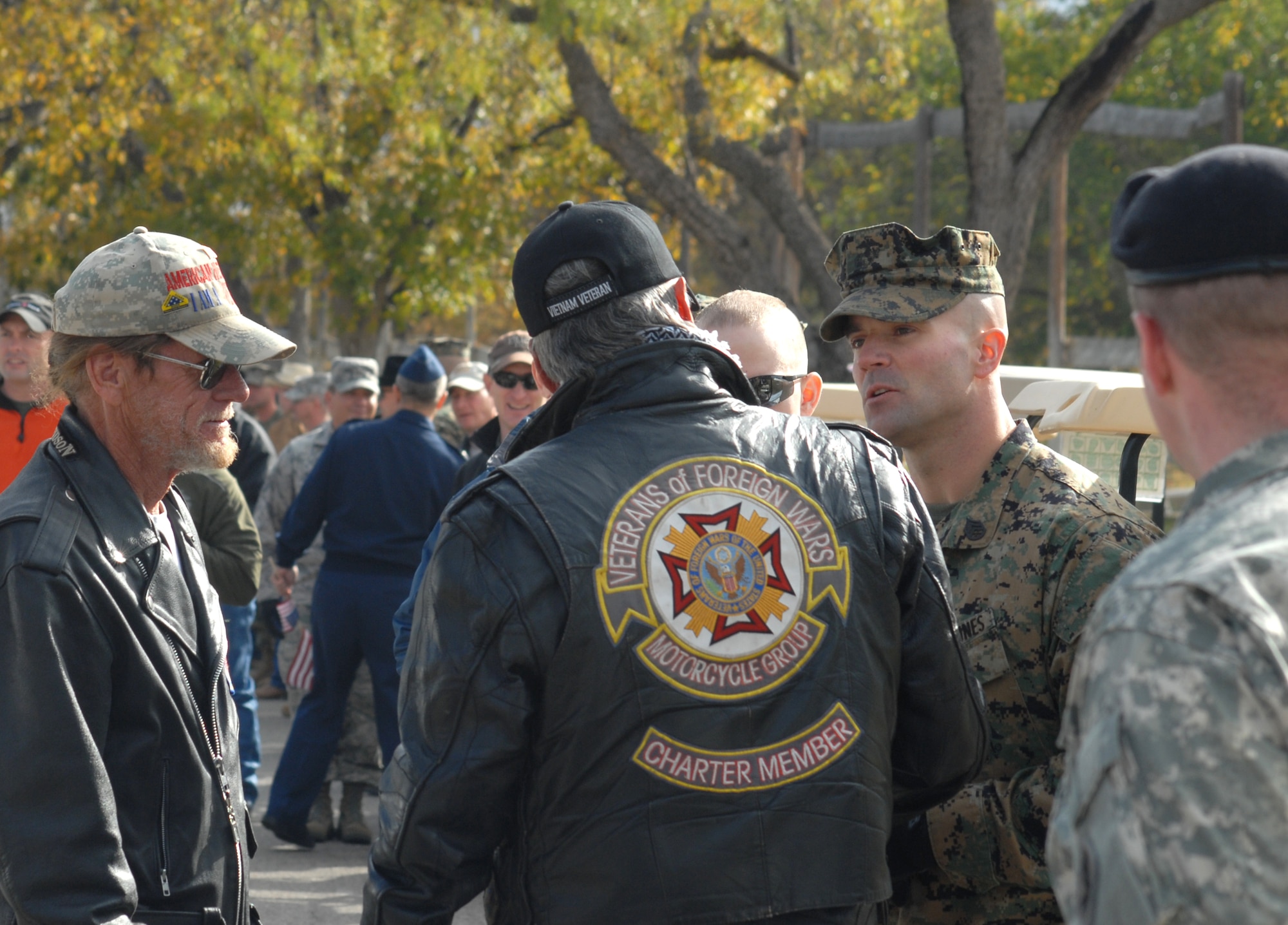Members of the Veterans of Foreign Wars Motorcycle Group speak to Marine Staff Sgt. Benjamin Clark from Goodfellow AFB, Texas, and Lance Corporal Matthew McSweeney, a wounded warrior, as they prepare to drive in the annual Hunt for Heroes parade through San Angleo on Nov. 20.  25 wounded veterans took part in the annual Hunt for Heroes event in West Texas, hosted by the Show of Support Military Hunt Inc., a nonprofit organization.  The criteria for the hunt are the veterans have to be wounded or disfigured and discharged from the military. (U.S. Air Force photo/Robert D. Martinez)
