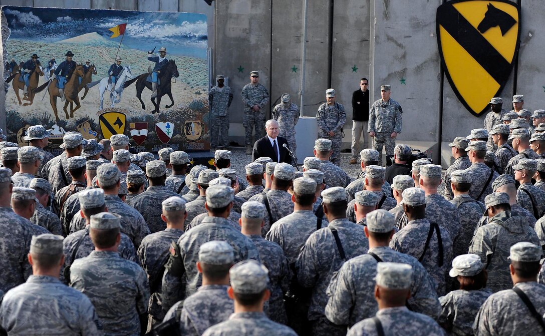 U.S. Defense Secretary Robert M. Gates holds a town hall meeting with 1st Cavalry Division "Blackjacks" and 1st Armored Division soldiers as well as Kirkuk Air Base airmen on Field Operating Base Warrior, Kirkuk, Iraq, Dec. 11, 2009. 