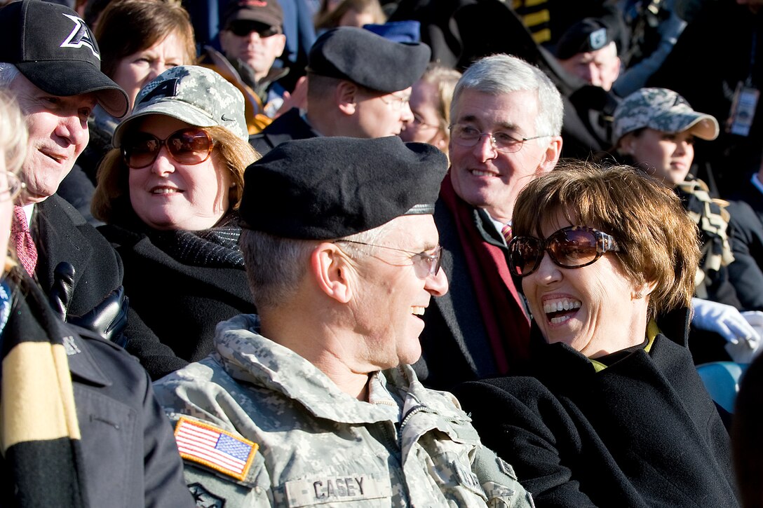 Left to right, back row, Defense Secretary Robert M. Gates, his wife Becky Gates and  Army Secretary John McHugh, and, front row, Army Chief of Staff Gen. George W. Casey Jr. and his wife, Sheila, share a laugh during the 110th Army-Navy football game at Lincoln Financial Field, Philadelphia, Dec. 12, 2009.