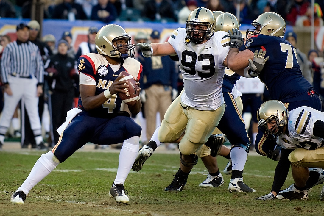 Navy quarterback Ricky Dobbs looks for a receiver during the 110th Army-Navy football game at Lincoln Financial Field, Philadelphia, Dec. 12, 2009.
