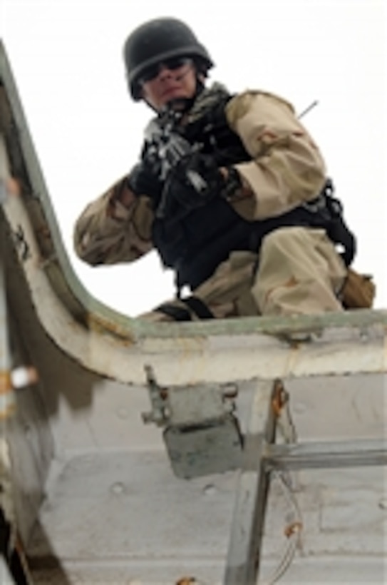 A U.S. Navy sailor with the USS Chosin's (CG 65) visit board search and seizure team practices a boarding technique during training aboard the ship while underway in the Gulf of Aden on Dec. 7, 2009.  The Chosin is the flagship for Combined Joint Task Force 151, a multinational task force established to conduct counter-piracy operations off the coast of Somalia.  