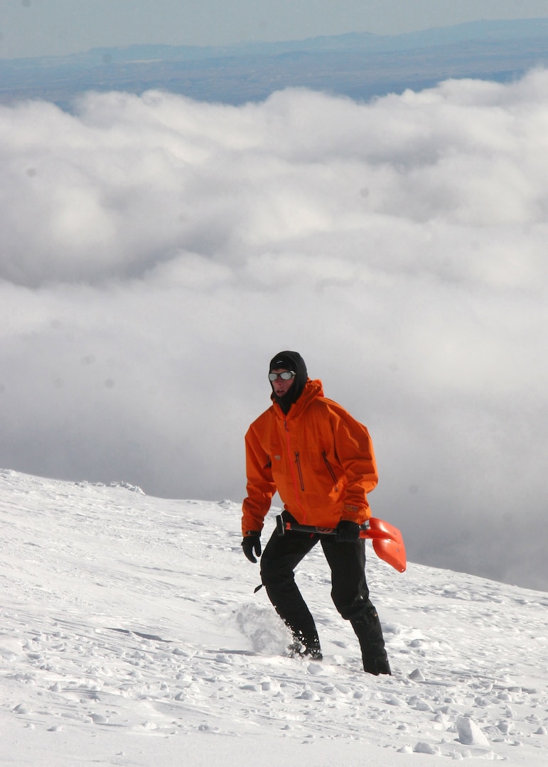 MT. HOOD, Ore. -  Staff Sgt. Philip Van Peursem hikes to join other members of the Air Force Reserve 304th Rescue Squadron as they prepare an area so they can provide emergency medical care if needed. The Reserve pararescuemen, or PJs, are called to use their search and rescue skills during high altitude, cold weather searches.(U.S. Air Force Photo/Senior Airman Adam Hoffmann)
