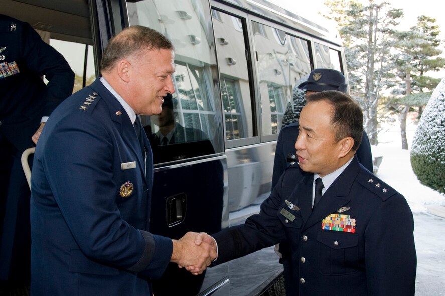 MISAWA AIR BASE, Japan -- Gen. Gary L. North, Commander, Pacific Air Forces, shakes hands with Japanese Air Self-Defense Force Lt. Gen. Kiyoshi Yada, Commander Northern Air Defense Force, Dec. 15.  General North and General Yada met at the Northern Air Defense Force headquarters to discuss JASDF and USAF relations.  (U.S. Air Force photo/Senior Airman Jamal D. Sutter)