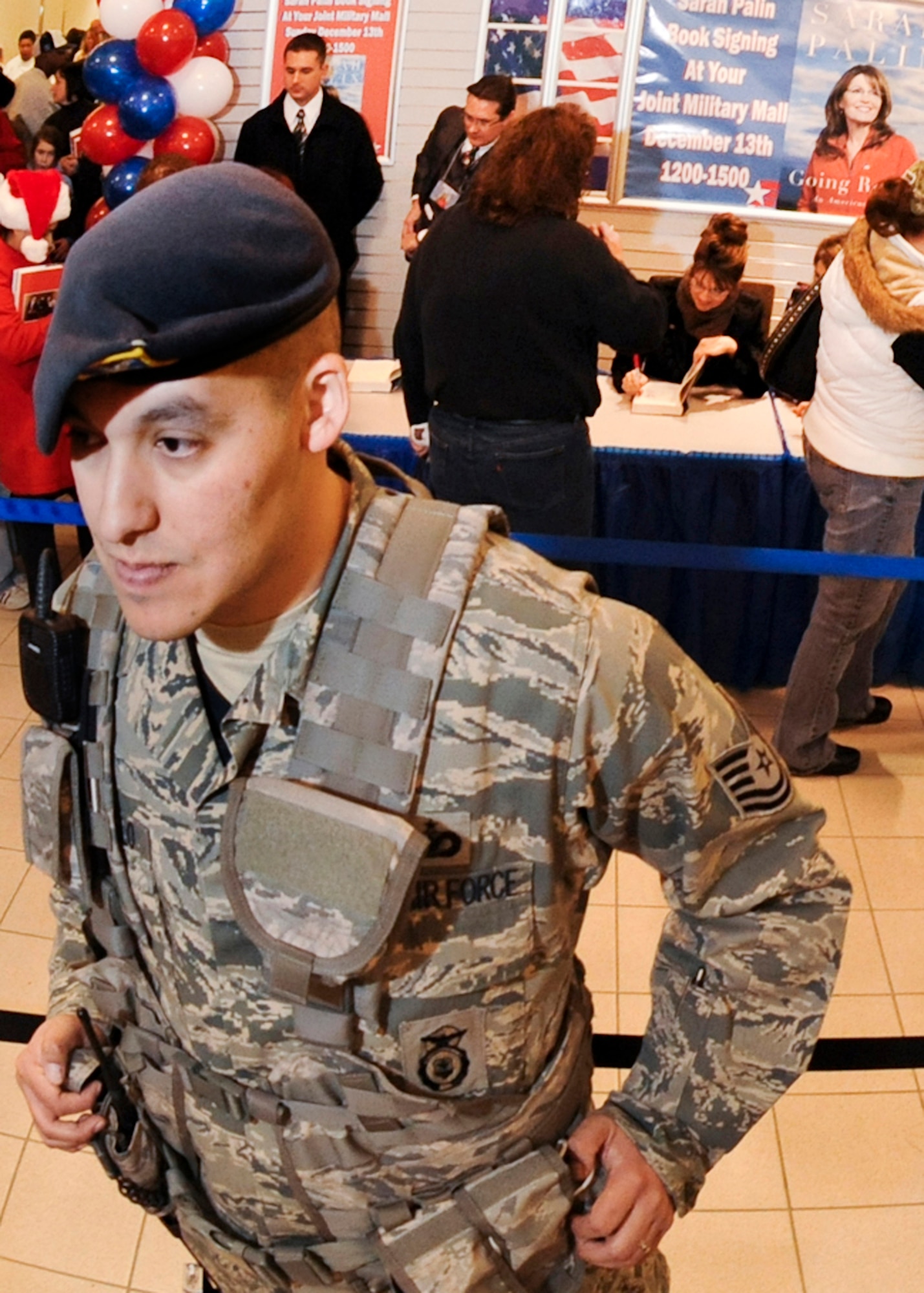 ELMENDORF AIR FORCE BASE, Alaska – Tech. Sgt. Jorge Camarillo, from the 3rd Security Forces Squadron monitors the approximately 2,000 people that were in attendance at the Elmendorf Joint Military Mall Dec. 13, during former Alaska Governor Sarah Palin’s signing of her new book “Going Rogue”. The doors at JMM opened up at 6 a.m. for the signing that took place from noon-3 p.m. (U.S. Air Force photo/Airman 1st Class Christopher Gross)