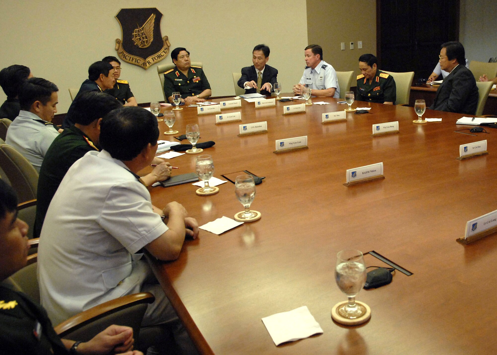 Maj. Gen David L. Commons, Mobilization Assistant, to the Pacific Air Forces, commander, briefs, Vietnamese, Minister of Defense, Gen. Phung Quang Thanh, and his delegation, during an office call to explain, PACAF's mission throughout its area of responsibility, at the Falcon Conference Room, headquarters, PACAF building, during a tour of Hickam Air Force Base, Hawaii, on Dec. 11. Gen. Phung Quang Thanh was accompanied by a delegation of 13 members, which consisted of both Vietnamese Army and Navy personnel. (U.S. Air Force photo/Tech. Sgt. Jerome S. Tayborn)