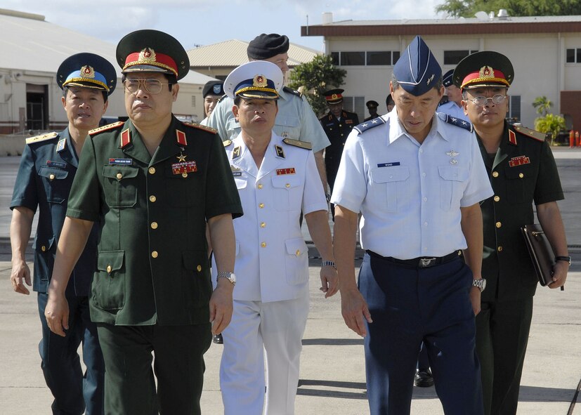 Maj. Gen Darryll Wong, Chief of Staff, Hawaii Air National Guard and commander of the Hawaii Air National Guard, escorts and briefs, Vietnamese, Minister of Defense, Gen. Phung Quang Thanh and his delegation, while explaining F-15 capabilites, during a tour of Hickam Air Force Base, Hawaii, on Dec. 11. Gen. Phung Quang Thanh was accompanied by a delegation of 13 members, which consisted of both Vietnamese Army and Navy personnel. (U.S. Air Force photo/Tech. Sgt. Jerome S. Tayborn)
