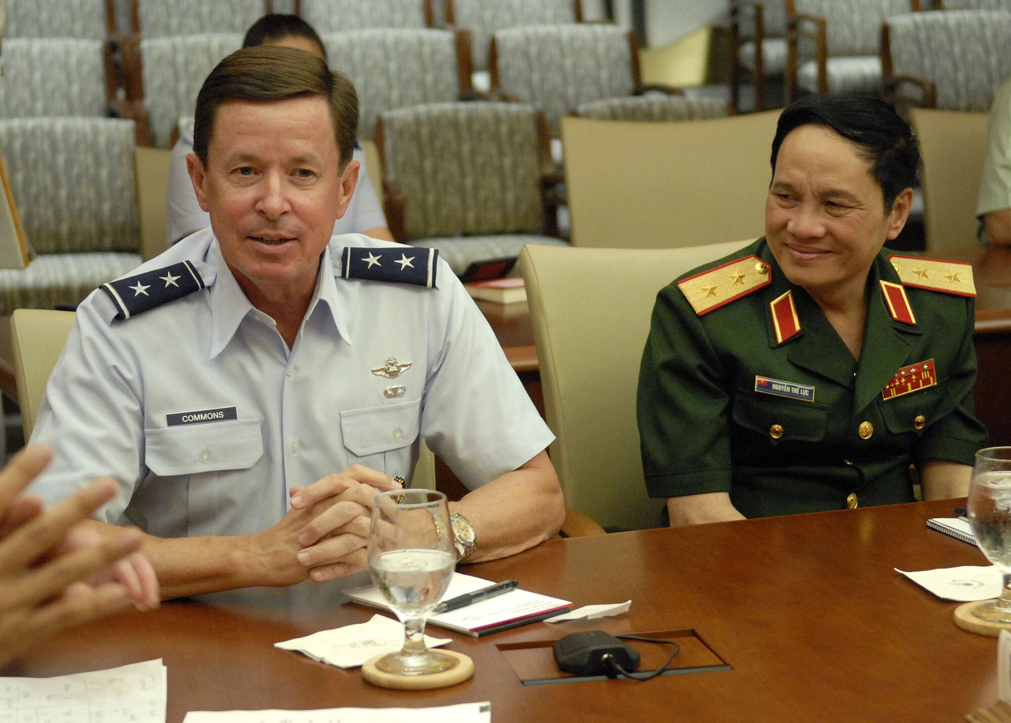 Maj. Gen David L. Commons, Mobilization Assistant, to the Pacific Air Forces, commander, briefs Vietnamese, Lt. Gen. Nguyen The Luc, Chief of Executive,  and other member of the delegation, at an office call, while explaining, PACAF's mission, throughout its area of responsiblity, at the Falcon Conference Room, headquarters, PACAF building, during a tour of Hickam Air Force Base, Hawaii, on Dec. 11. (U.S. Air Force photo/Tech. Sgt. Jerome S. Tayborn)
