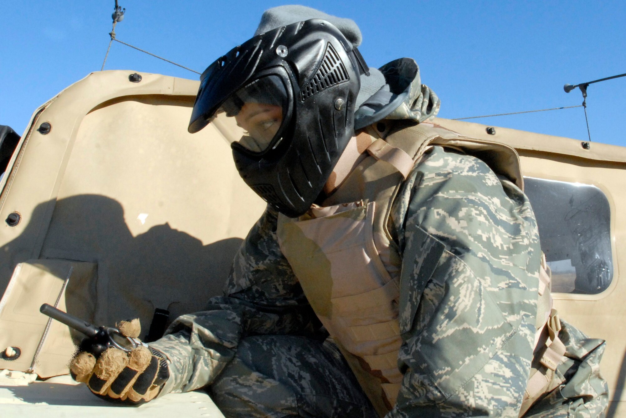 Senior Airman Alyssa Gomez waits for word via radio from her colleagues on when to proceed during a
reconnaissance mission during Patriot 7 Dec. 10, 2009, at Fort Pickett, Va. About 30 Air Force, joint and
coalition trainees conducted integrated sensor, aircraft and counterterrorism training to learn how to make more dynamic decisions on the battlefield. Airman Gomez is from 99th Security Forces Squadron ground combat, Nellis Air Force Base, Nev. (U.S. Air Force photo/Tech. Sgt. Amaani Lyle)
