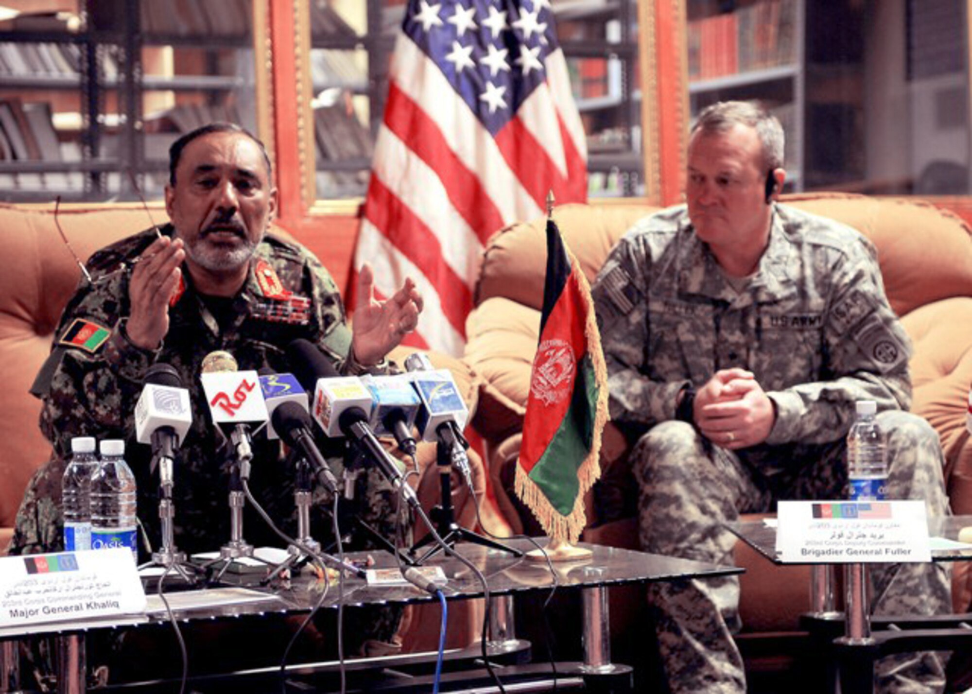 Afghan Maj. Gen. Abdul Khaliq (left) speaks about the Department of Defense Rewards Program and Operation Jaeza Dec. 7, 2009, during a press conference at Forward Operating Base Thunder, Gardez District in Afghanistan. The Afghan National Army 203rd Corps commander and deputy commander, Army Brig. Gen. Kurt Fuller (right) shared details on local and national news programs about the monetary rewards program to gain actionable information or non-lethal assistance from citizens to disrupt or defeat enemy activities, particularly the use of improvised explosive devices. General Fuller also serves as the Combined Joint Task Force-82 deputy commander. (U.S. Air Force photo/Tech. Sgt. Jennifer Lindsey)