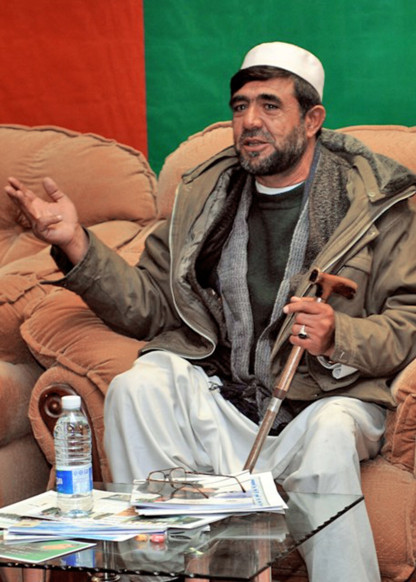A local citizen who lost his leg from an improvised explosive device detonation encourages people to help protect one another by reporting enemy activities through the Department of Defense Rewards Program and Operation Jaeza Dec. 7, 2009 in Afghanistan. The citizen's sons had to drop out of school following their father's disability to help support the family. Reporters interviewed Afghan Maj. Gen. Abdul Khaliq and Army Brig. Gen. Kurt Fuller about the monetary rewards program to gain actionable information or non-lethal assistance from citizens during a press conference at Forward Operating Base Thunder, Gardez District, Afghanistan. General Khaliq is the the Afghan National Army 203rd Corps commander. General Fuller is 203rd Corps deputy commander and the Combined Joint Task Force-82 deputy commander. (U.S. Air Force photo/Tech. Sgt. Jennifer Lindsey) 