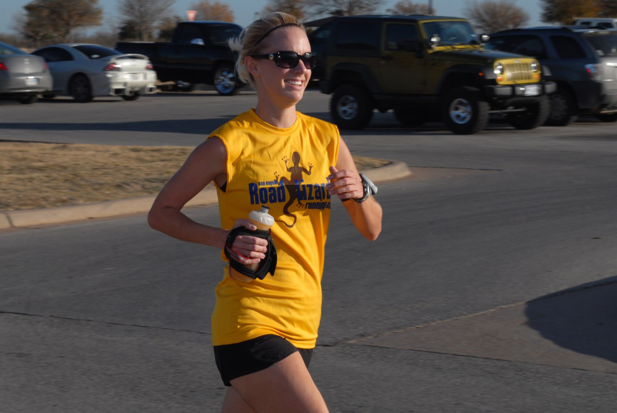 GOODFELLOW AIR FORCE BASE, Texas -- Ruthie Kreuzer, finishes the final leg of the 2009 Jingle Bell fun run/walk, Dec. 14. Ms. Kreuzer took first place in the women's category with a time of 16 minutes, 41 seconds, and is married to Capt. Michael Kreuzer from the 315th Training Squadron. (U.S. Air Force photo/Staff Sgt. Laura R. McFarlane)

