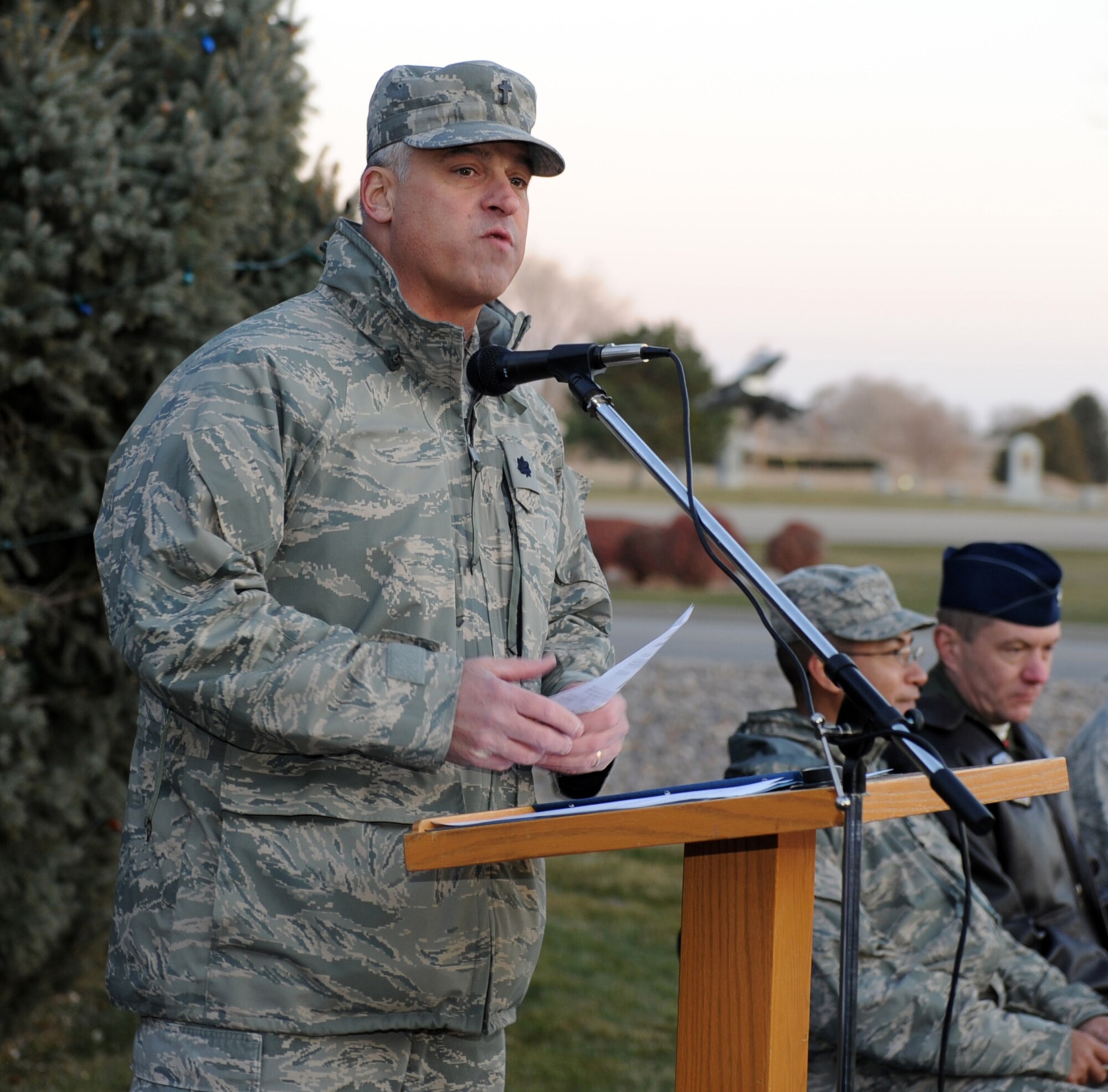 MOUNTAIN HOME AIR FORCE BASE, Idaho -- Chaplain (Lt. Col.) Dennis Saucier, 366th Fighter Wing chapel office, gives a speech before the annual Christmas tree lighting ceremony Dec. 4. The First Sergeants Association and base chapel teamed up to put together a holiday parade followed by a Christmas tree lighting ceremony. (U.S. Air Force photo by Master Sgt. Tim Cook)