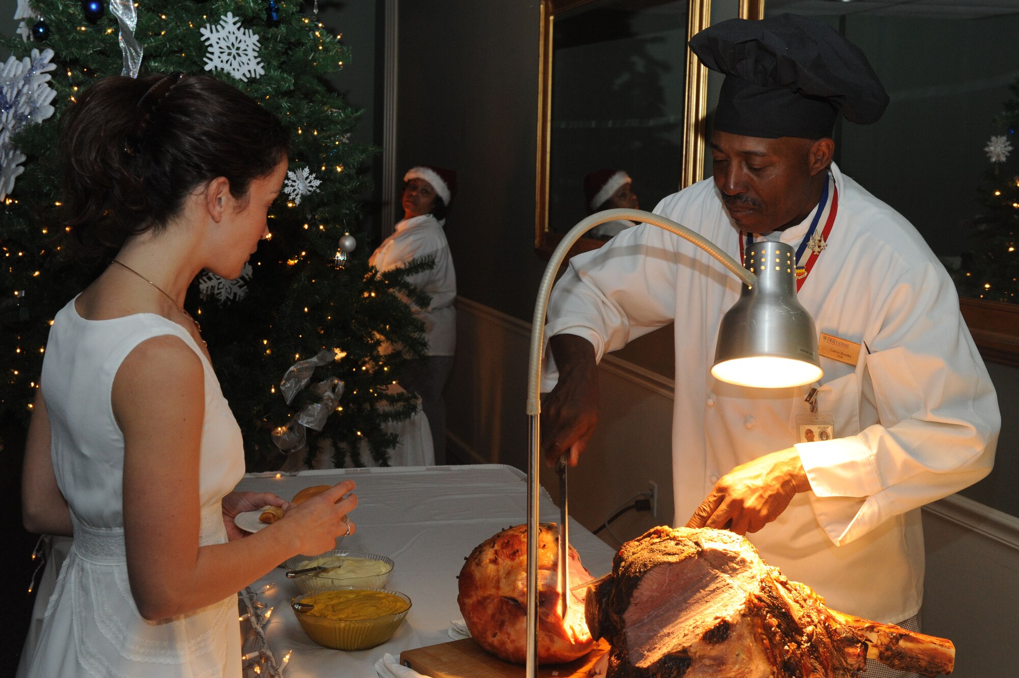 SHAW AIR FORCE BASE, S.C. -- Calvin Brooks, 20th Force Support Squadron Carolina Skies Club chef, carves turkey during the 20th Fighter Wing holiday party Dec. 12. (U.S. Air Force photo/Senior Airman David Minor)